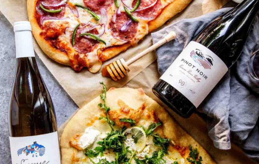 Pizza and bottles of wine